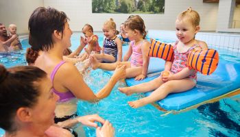 Parent and child swimming